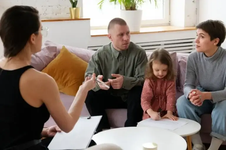 Independent patient advocate meeting with a family to discuss healthcare needs, care coordination, and patient-centered advocacy support.